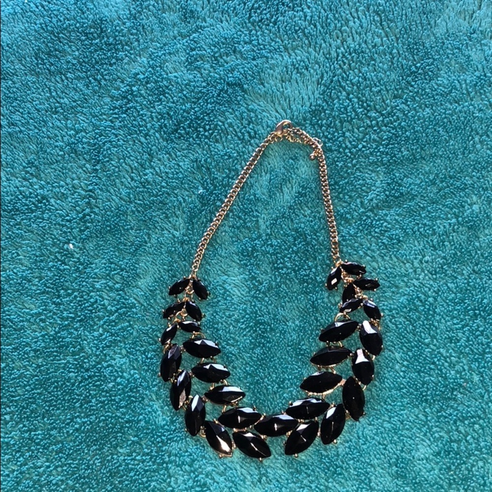 gold and black necklace